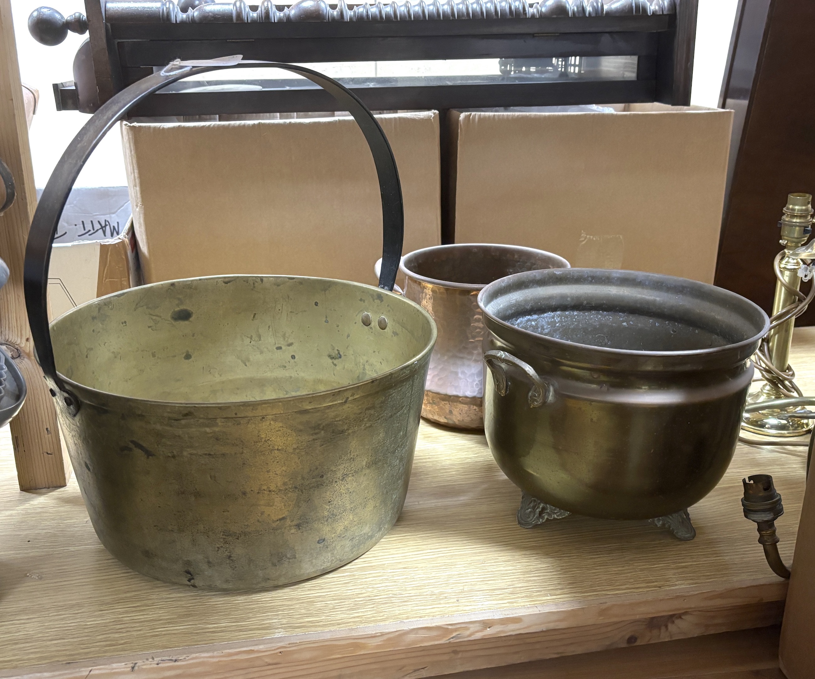 A large brass pan, a brass planter and similar copper planter, brass pan 35cm diameter